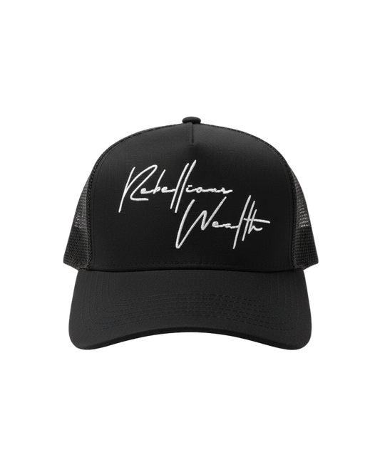 Front view of the RWLS Black snapback trucker hat with mesh sides and white handwritten "rebellious Wealth" script text logo on the front panel.  Black base with white highlights as the colorway. rebelliouswealth.com