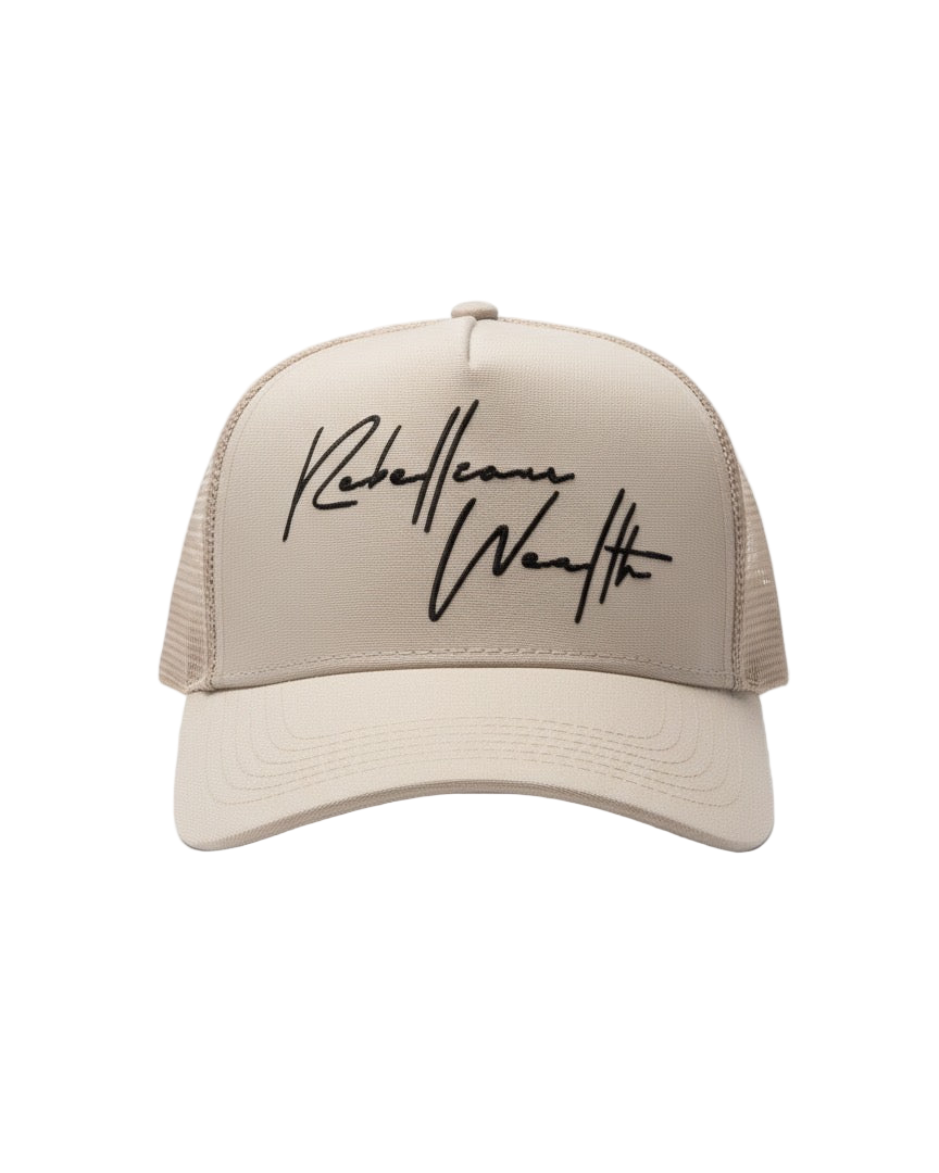 Beige cream color trucker snapback hat with Black 'Rebellious Wealth' signature script text logo on the front panel. Mesh side panels. rebelliouswealth.com 