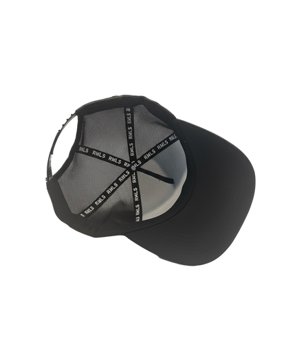 Interior view of the Black Rebellious Wealth trucker snapback hat. Mesh side panels and dual snapback strap. RWLS logos printed along the inseam tape. rebelliouswealth.com