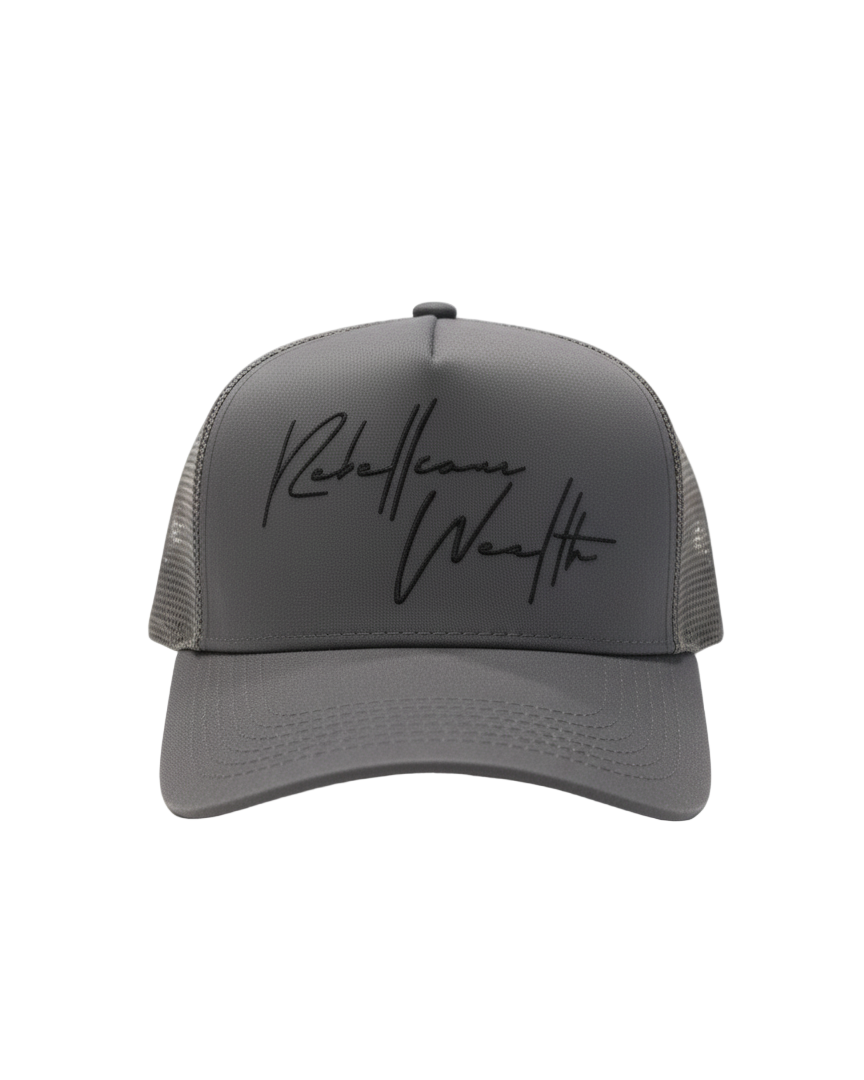Stone Gray Rebellious Wealth trucker hat with a black "Rebellious Wealth signature on the front panel. Mesh side panels and dual snapback strap. rebelliouswealth.com